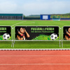 Barrier fences with tarpaulins, used at sporting events
