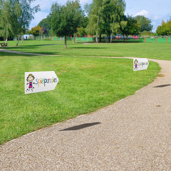 Double-sided printed garden signs as mobile directional indicators