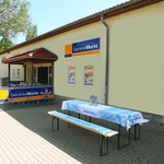 Beer table with printed tablecloth and matching beer bench seat cushions