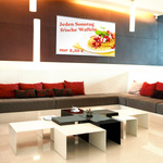 Textile poster with metal edging as decorative advertising surface in cafés