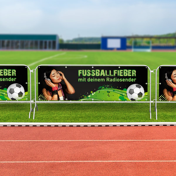 Barrier fences with tarpaulins, used at sporting events