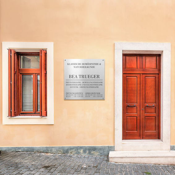 High-quality company sign and directional sign on facades