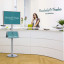 Display with image advertising and brochures in reception area