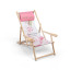 Wooden deck chair with armrests and drink holder with printed neck pillow