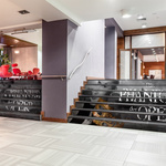 Floor film with theater advertising, attached to the staircase in the foyer