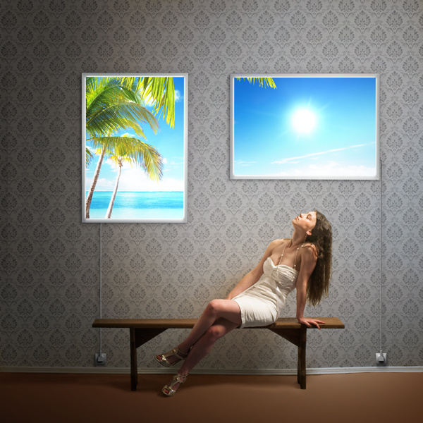 Backlit film for illuminated wall frames