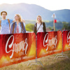 Barrier fence with textile advertising covers