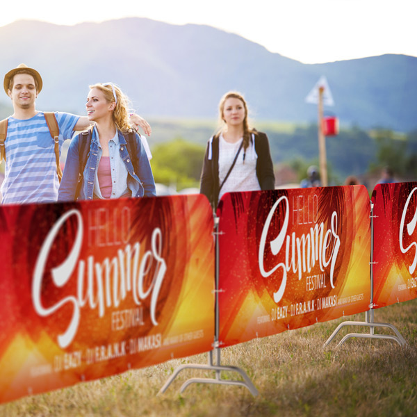 Barrier fence with textile advertising covers