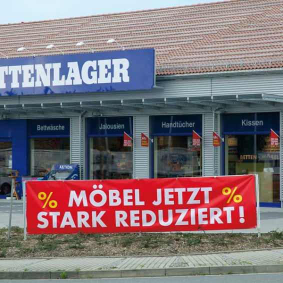 Tension banner in landscape format with promotional advertising