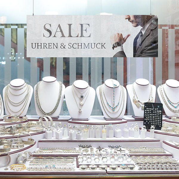 freely hanging promotional advertising sign in shop windows