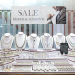 freely hanging promotional advertising sign in shop windows